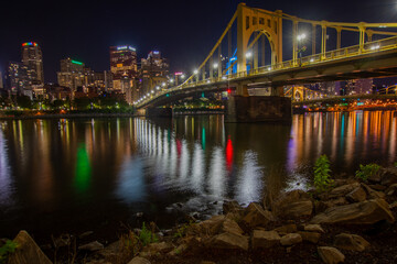 Night time cityscape of downtown Pittsburgh Pennsylvania as seen from across the Allegheny River