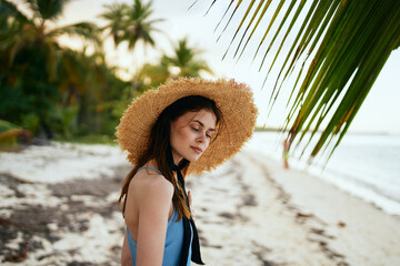 woman in swimsuit by the ocean island sun tropics