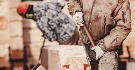Carpenter worker with log wooden. Woodwork job, house frame building
