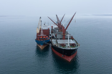 The dry-cargo ships costs in the sea. Vessels overload cargo.