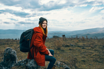 cheerful woman hiker walking in the mountains active vacation travel