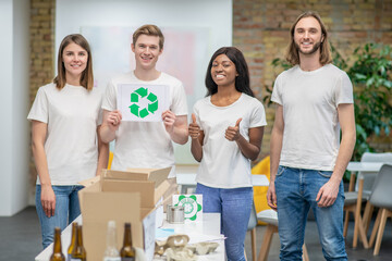 Young ecologists working in a recycling center