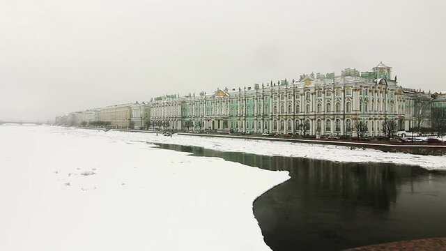 Frozen River Neva and the Hermitage in winter. Traffic on the embankment, St Petersburg, Russia
