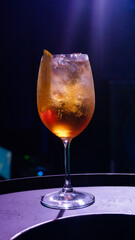 Drink Aperol Spritz in a black wall