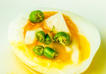 Soft boiled eggs spicy salad in plate,  close up in studio Chiangmai Thailand.