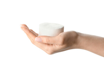 Female hand with stack of clean cotton pads on white background