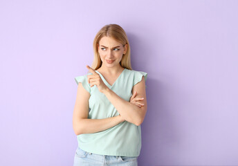 Young gossiping woman on color background