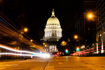 Traffic goes by the Wisconsin State Capitol Building at night