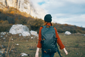 woman tourist with cutter near mountains travel landscape adventure