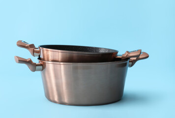 Cooking pots on blue background