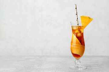 Glass of melon cocktail on light background