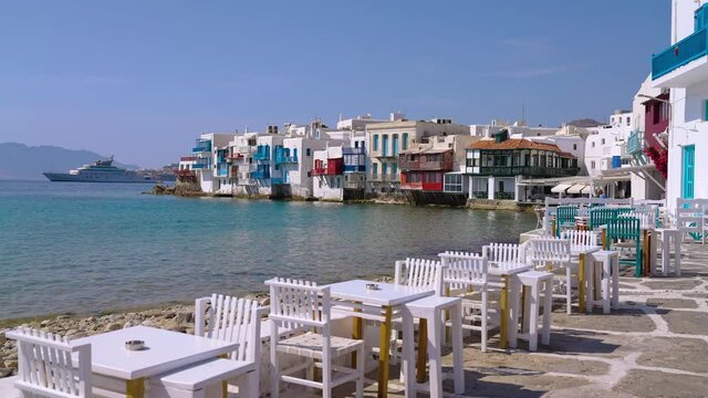 Picturesque Waterfront Restaurant Cafe Tables and Chairs in Little Venice,  Mykonos, Greece