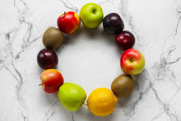 Frame made of fresh fruits on light background. Vegan Day