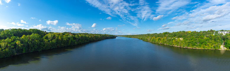 Aerial view of Mississippi river with green trees,  blue sky and white clouds panorama Minnesota ...