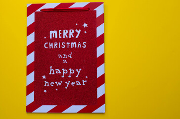 Lettering Merry christmas and happy new year on a red light wooden board