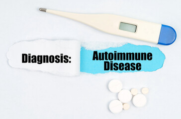 Medical diagnosis. On paper a thermometer, pills and a hole, inside which the inscription -...