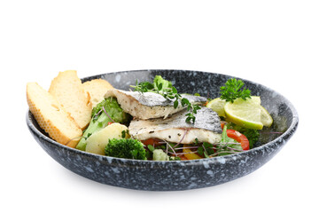 Plate of tasty sea bass fish with vegetables on white background