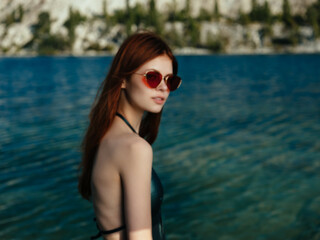 woman wearing green swimwear sunglasses posing leisure lifestyle