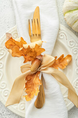 Stylish autumn table setting with acorn, closeup