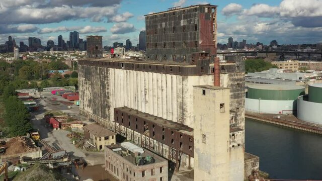 Aerial rise near massive abandoned grain terminal in Brooklyn New York City
