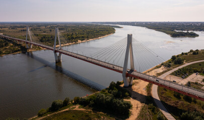 Obraz premium Drone view of the summer landscape of the Oka River and the cable-stayed Muromsky Bridge, Russia