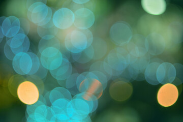 Green defocused background with blue bokeh circles - 467065423
