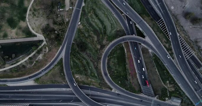 Top view of curves and highways full of traffic