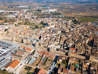 Fototapeta premium View from drone of Montblanc cityscape with battlements of fortress wall, Tarragona, Spain
