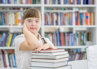 Portrait of a young girl with  special needs at library