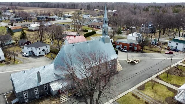 Aerial Reveal of Historic Church Building in Rural Small Town of Beaumont, Quebec