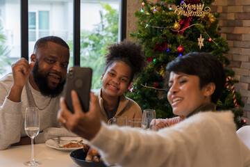 Parents and children make dancing video for social media on Christmas