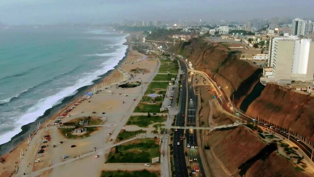 Sunset / Dusk Mid Time Lapse Loop Showing City Waterfront View. The view of the "Green Coast" in the city of Lima-Peru, aerial view in timelapse.