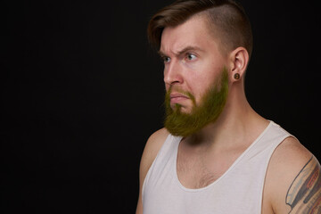 Obraz premium stylish bearded man in a white t-shirt with tattoos on his arms fashion