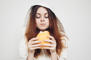 red-haired woman eating a sandwich snack lunch