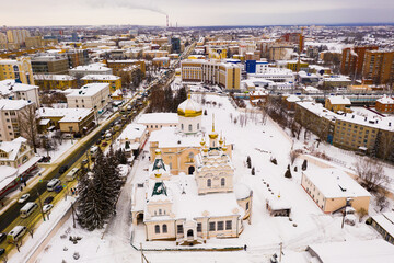 Fototapeta premium Winter aerial view of Orthodox Holy Trinity Monastery in snow covered Penza city in Russia