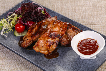 Grilled pork ribs with celery and carrot