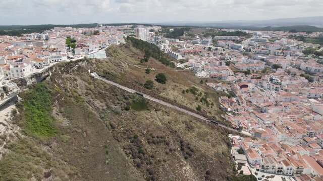 Aerial Orbit over Nazar&eacute; Railway Funicular on hillside scenic overlook of Sit&iacute;o Nazar&eacute;