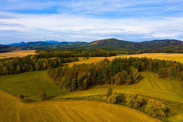 Panoramic countryside autumn view of hills and fields