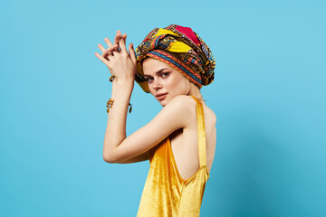 cheerful woman ethnicity multicolored headscarf makeup glamor isolated background