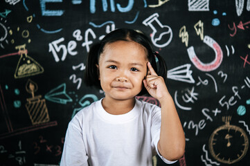 Portrait lovely girl front of education blackboard in background