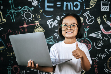 Portrait lovely girl front of education blackboard in background