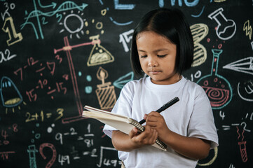 Portrait lovely girl front of education blackboard in background
