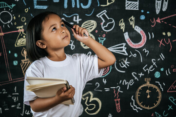 Portrait lovely girl front of education blackboard in background