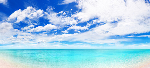 Fototapeta premium Beautiful tropical beach bay panorama background, exotic island landscape panoramic view backdrop, turquoise sea water, blue ocean lagoon, sand, sunny sky white clouds, summer holidays vacation travel