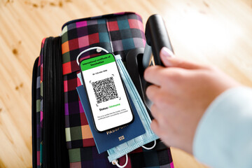 The man showing digital vaccination certificate health passport app in mobile phone. certificate COVID 19