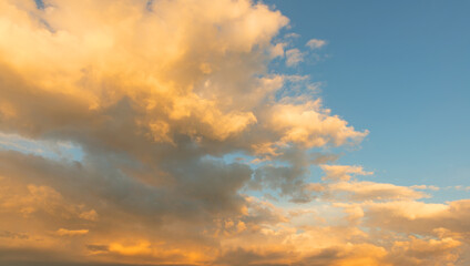 Naklejka na ściany i meble Background photos of an expressive sky with colored clouds