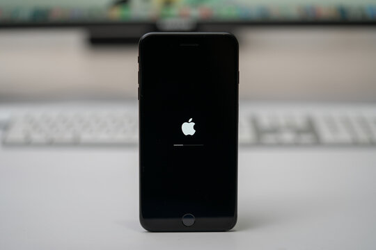 Apple IPhone Updated IOs, Apple Icon And Status Bar On Screen, Selective Focus