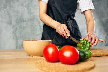 Woman in black apron Cooking healthy eating salad diet