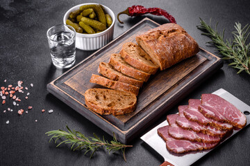Delicious fresh bacon sliced with bread and vegetables