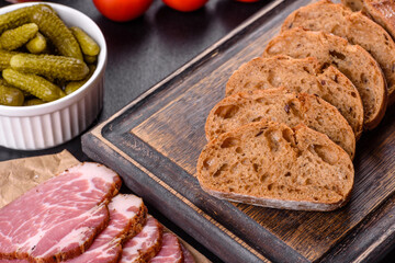 Delicious fresh bacon sliced with bread and vegetables